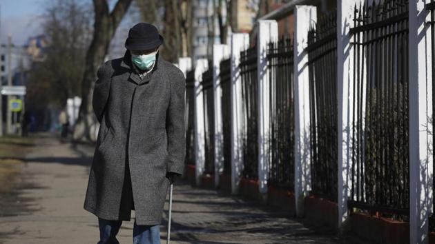 A elderly man wearing a mask, walks on street in Minsk, Belarus. (AP) A elderly man wearing a mask, walks on street in Minsk, Belarus. (AP)