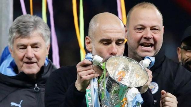 File image: Manchester City manager Pep Guardiola and the first team staff celebrate with the trophy after winning the Carabao Cup. (REUTERS) File image: Manchester City manager Pep Guardiola and the first team staff celebrate with the trophy after winning the Carabao Cup. (REUTERS)