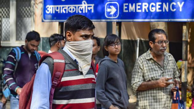 A man uses a handkerchief to cover his face in the wake of coronavirus outbreak, at RML Hospital in New Delhi on Tuesday.(PTI Photo) A man uses a handkerchief to cover his face in the wake of coronavirus outbreak, at RML Hospital in New Delhi on Tuesday.(PTI Photo)