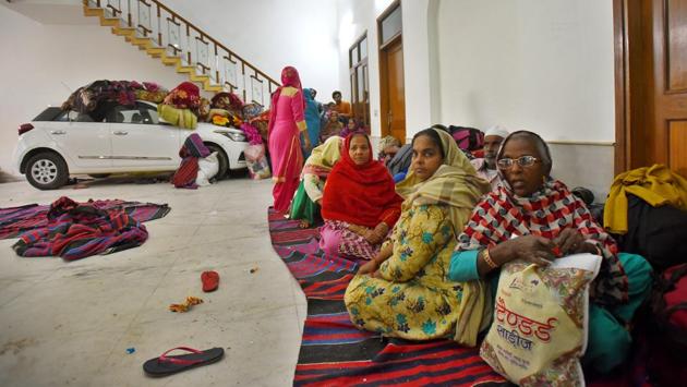 Women rescued during the violence take shelter inside a house at Shiv Puri on February 28. (Amal KS / HT Photo)