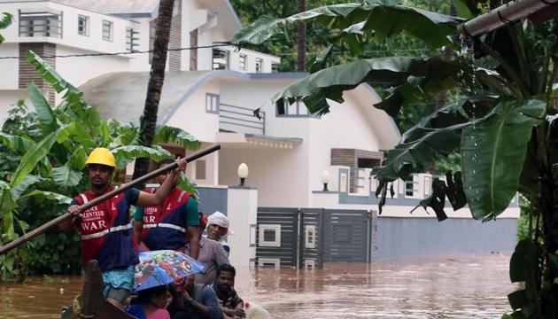 File photo: Police volunteers help people ride a boat during the flood at Chengalayi, in Kannur district of Kerala, India, on Thursday, August 8, 2019.(HT Photo) File photo: Police volunteers help people ride a boat during the flood at Chengalayi, in Kannur district of Kerala, India, on Thursday, August 8, 2019.(HT Photo)