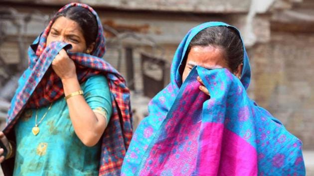 Women break down following violent clashes over the new citizenship law that left many homes destroyed on February 26. (Raj K Raj / HT Photo)