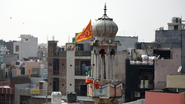A view of the Badi Masjid that was burnt by miscreants during clashes over the new citizenship law, at Ashok Nagar, on February 26. A flag with a Hindu religious deity was mounted atop the Masjid. (Amal KS / HT Photo)