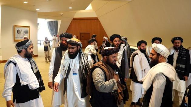 Members of the Taliban delegation gather ahead of an agreement signing between them and U.S. officials in Doha, Qatar. (REUTERS) Members of the Taliban delegation gather ahead of an agreement signing between them and U.S. officials in Doha, Qatar. (REUTERS)
