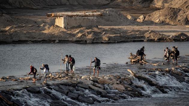 Migrants cross Meric river as they walk towards the Turkey’s Pazarkule border crossing. Inside Syria there was ample evidence of the renewed fighting that has caused perhaps the worst humanitarian crisis of the conflict. A million civilians have been displaced since December inside Syria near the Turkish border in desperate winter conditions. Turkey, already home to 3.7 million Syrian refugees, says it cannot take more. (Marko Djurica / REUTERS) Migrants cross Meric river as they walk towards the Turkey’s Pazarkule border crossing. Inside Syria there was ample evidence of the renewed fighting that has caused perhaps the worst humanitarian crisis of the conflict. A million civilians have been displaced since December inside Syria near the Turkish border in desperate winter conditions. Turkey, already home to 3.7 million Syrian refugees, says it cannot take more. (Marko Djurica / REUTERS)