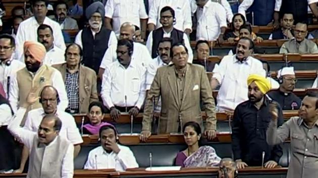 Opposition MPs raise slogans in Lok Sabha demanding discussion on Delhi violence, on Tuesday. (ANI Photo) Opposition MPs raise slogans in Lok Sabha demanding discussion on Delhi violence, on Tuesday. (ANI Photo)