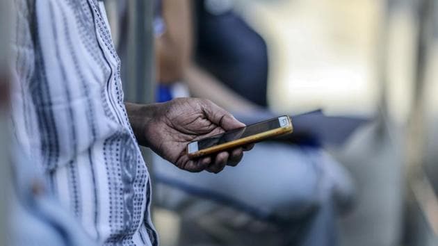 A man uses a smartphone in Mumbai, India, on Saturday, Feb. 15, 2020. Facebook, YouTube, Twitter and TikTok will have to reveal users' identities if Indian government agencies ask them to, according to the country’s controversial new rules for social media companies and messaging apps expected to be published later this month. Photographer: Dhiraj Singh/Bloomberg(Bloomberg) A man uses a smartphone in Mumbai, India, on Saturday, Feb. 15, 2020. Facebook, YouTube, Twitter and TikTok will have to reveal users' identities if Indian government agencies ask them to, according to the country’s controversial new rules for social media companies and messaging apps expected to be published later this month. Photographer: Dhiraj Singh/Bloomberg(Bloomberg)