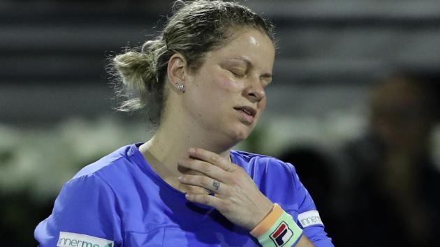 Belgium's Kim Clijsters reacts in a match against Spain's Gabrine Muguruza.(AP)