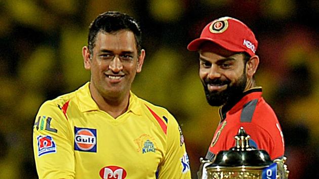 Representative image: File image of CSK skipper MS Dhoni and RCB captain Virat Kohli with IPL trophy.(AFP)