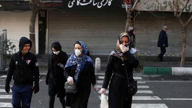 Iranian people wear protective masks to prevent contracting a coronavirus, in Tehran, Iran. (REUTERS) Iranian people wear protective masks to prevent contracting a coronavirus, in Tehran, Iran. (REUTERS)