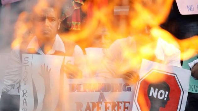 People hold placards and shout slogans as they take part in a protest against the alleged rape and murder of a 27-year-old woman on the outskirts of Hyderabad, in New Delhi. (REUTERS) People hold placards and shout slogans as they take part in a protest against the alleged rape and murder of a 27-year-old woman on the outskirts of Hyderabad, in New Delhi. (REUTERS)