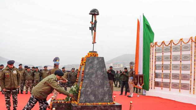 CRPF personnel pay tribute at a memorial to the 40 CRPF jawans, who were killed in the Pulwama terror attack in February last year, at Letapora of Pulwama District of South Kashmir. (PTI) CRPF personnel pay tribute at a memorial to the 40 CRPF jawans, who were killed in the Pulwama terror attack in February last year, at Letapora of Pulwama District of South Kashmir. (PTI)