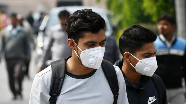 People in New Delhi are seen wearing protective masks after spread of coronavirus in the country. Health minister Hash Vardhan said there are 29 confirmed cases in the country.(Biplov Bhuyan/HT Photo)