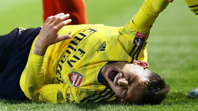 FILE PHOTO: Soccer Football - FA Cup Fifth Round - Portsmouth v Arsenal - Fratton Park, Portsmouth, Britain - March 2, 2020 Arsenal's Lucas Torreira reacts after sustaining an injury REUTERS/David Klein/File Photo(REUTERS) FILE PHOTO: Soccer Football - FA Cup Fifth Round - Portsmouth v Arsenal - Fratton Park, Portsmouth, Britain - March 2, 2020 Arsenal's Lucas Torreira reacts after sustaining an injury REUTERS/David Klein/File Photo(REUTERS)