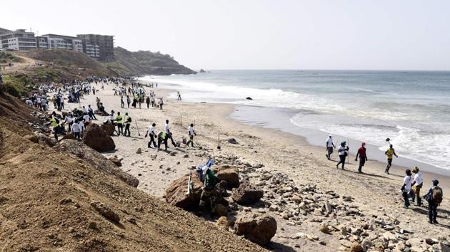 The city beach, named Cap-Manuel, is bordered by turquoise waters on one side and construction sites on the other. It’s a hit with locals, and children often use it as a football pitch.  (Seyllou / AFP) 