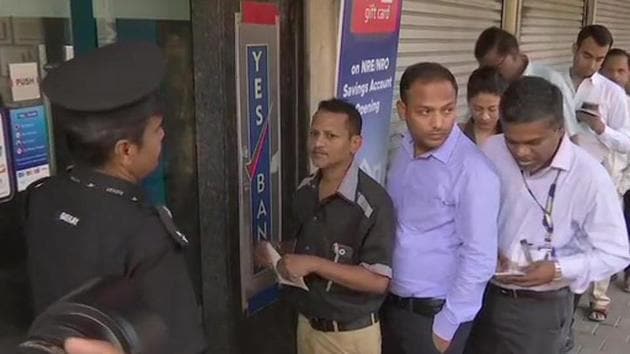 Yes Bank customers queue up outside the Fort branch on Friday morning.(ANI Photo)