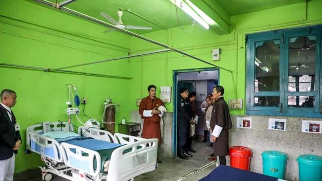 In this handout photograph taken and released by Bhutan Prime Minister's Office on February 2, 2020, Bhutan's Prime Minister Lotay Tshering (R) visits Gelephu hospital where an isolation ward is set up in Gelephu at the India-Bhutan border.(AFP)