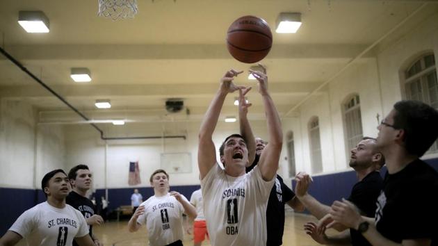 Seminarian John Paul Heisler plays basketball at St. Charles Borromeo Seminary. Some 4,853 men were enrolled in college-level programs at Catholic seminaries in the US last school year, according to the Center for Applied Research in the Apostolate, or CARA. That was a slight increase over the prior two years and not markedly different from a decade earlier. (Wong Maye-E / AP) Seminarian John Paul Heisler plays basketball at St. Charles Borromeo Seminary. Some 4,853 men were enrolled in college-level programs at Catholic seminaries in the US last school year, according to the Center for Applied Research in the Apostolate, or CARA. That was a slight increase over the prior two years and not markedly different from a decade earlier. (Wong Maye-E / AP)
