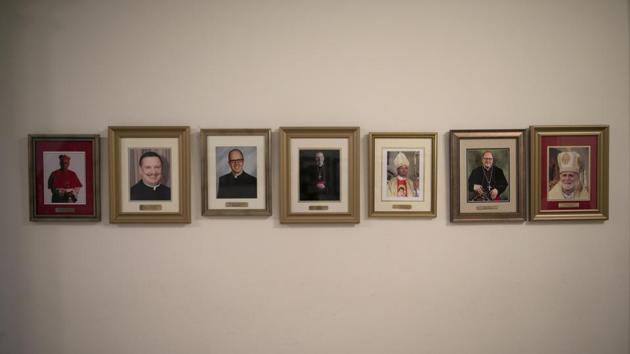 Photos of bishops and leaders of religious orders line a hallway at St. Charles Borromeo Seminary. Mostly, seminarians are focused on the tasks at hand: Immersing themselves in prayer and study, making it to ordination and living up to the vows they make. They speak with hope of the church moving past its crises, focusing largely on the examples they will set versus institutional changes. (Wong Maye-E / AP) Photos of bishops and leaders of religious orders line a hallway at St. Charles Borromeo Seminary. Mostly, seminarians are focused on the tasks at hand: Immersing themselves in prayer and study, making it to ordination and living up to the vows they make. They speak with hope of the church moving past its crises, focusing largely on the examples they will set versus institutional changes. (Wong Maye-E / AP)