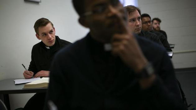 Seminarian Daniel Rice (L) sits with classmates during a lesson on the Gospel of Luke. Future Catholic priests remain unflinchingly optimistic despite scandals that have driven faithful from the pews. (Wong Maye-E / AP) Seminarian Daniel Rice (L) sits with classmates during a lesson on the Gospel of Luke. Future Catholic priests remain unflinchingly optimistic despite scandals that have driven faithful from the pews. (Wong Maye-E / AP)