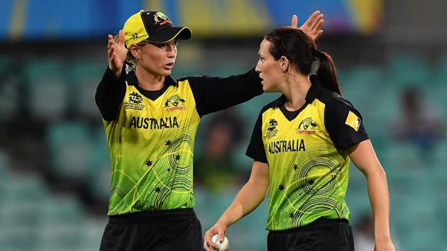 Australia's Rachael Haynes (L) gives instructions to bowler Megan Schutt.(AFP)