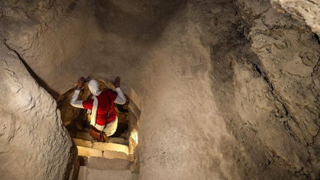 A woman tours inside the step pyramid of Djoser. Egypt has touted a flurry of archaeological finds in recent years, in the hope of boosting its vital tourism sector, which has suffered multiple shocks since the 2011 uprising. Last year, authorities unveiled a 4,500-year-old burial ground near the Giza pyramids replete with colourful wooden coffins and limestone statues. (Mohamed el-Shahed / AFP)