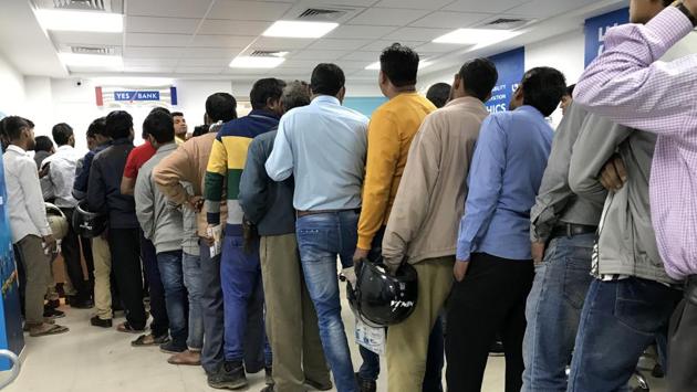 One of the customers of Yes Bank’s Noida Sector 18 branch claimed that in his two years of association with bank, he had never seen so many people inside the bank premises.“Usually there are very few people inside the bank to deposit or withdraw money, but now it feels like we have entered into a government bank. The rush is huge inside,” said Karan Gera, who works in Noida. (Parveen Kumar / HT Photo) One of the customers of Yes Bank’s Noida Sector 18 branch claimed that in his two years of association with bank, he had never seen so many people inside the bank premises.“Usually there are very few people inside the bank to deposit or withdraw money, but now it feels like we have entered into a government bank. The rush is huge inside,” said Karan Gera, who works in Noida. (Parveen Kumar / HT Photo)