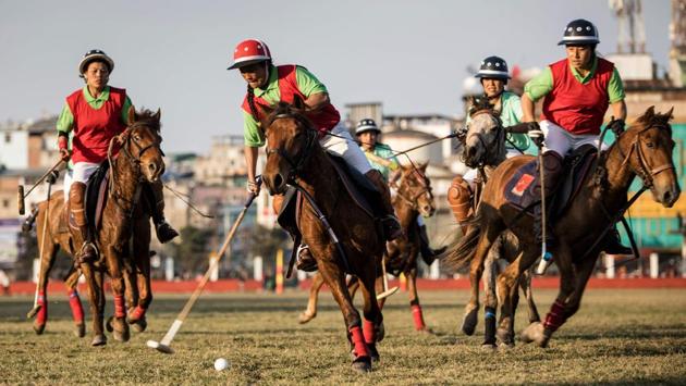 Linthoingambi Kangjei Lup Polo Club player Khundongbam Dementy (C) shoots to score during their 15th Women’s State Polo Tournament match against Chingkheihunba Polo Club at the Mapal Kangjeibung (Polo Ground) in Imphal. The women’s involvement flies in the face of the usual expectations in Manipur that they should primarily be caregivers. (Xavier Galiana / AFP) Linthoingambi Kangjei Lup Polo Club player Khundongbam Dementy (C) shoots to score during their 15th Women’s State Polo Tournament match against Chingkheihunba Polo Club at the Mapal Kangjeibung (Polo Ground) in Imphal. The women’s involvement flies in the face of the usual expectations in Manipur that they should primarily be caregivers. (Xavier Galiana / AFP)