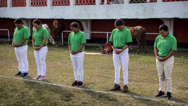 Linthoingambi Kangjei Lup Polo Club players (L-R) team captain Khundongbam Habe, Laishram Thadoi, Khundongbam Dementy, Shanglenmayum Sangeeta and Okram Ashalucky pray during their first match of the 15th Women’s State Polo Tournament. Ashalucky said that the team is working hard and playing with courage and she believes they will play better than men. (Xavier Galiana / AFP) Linthoingambi Kangjei Lup Polo Club players (L-R) team captain Khundongbam Habe, Laishram Thadoi, Khundongbam Dementy, Shanglenmayum Sangeeta and Okram Ashalucky pray during their first match of the 15th Women’s State Polo Tournament. Ashalucky said that the team is working hard and playing with courage and she believes they will play better than men. (Xavier Galiana / AFP)