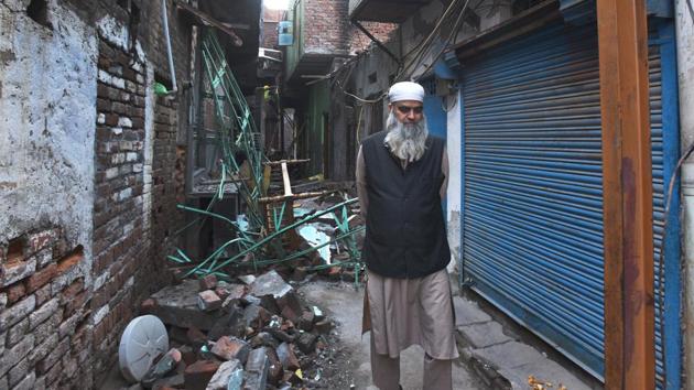 A resident passes by a burnt house after communal violence in northeast Delhi last week over the Citizenship Amendment Act (CAA), at Shiv Vihar, in New Delhi, India, on Thursday, March 5, 2020.