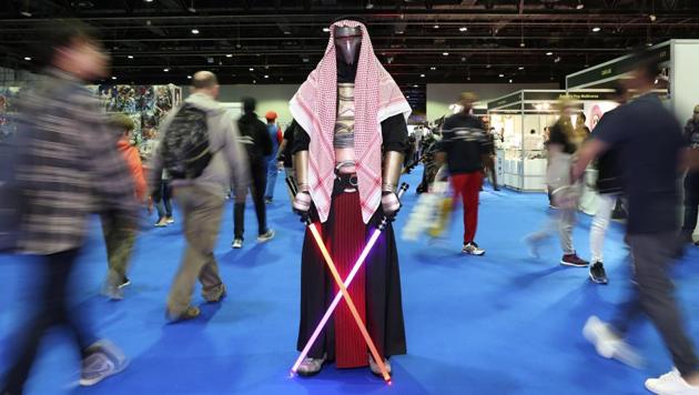A cosplayer dressed as a creation from "Star Wars" attends the Middle East Comic Con in Dubai, United Arab Emirates, Thursday, March 5, 2020. The Middle East Film & Comic Con has begun in Dubai, a city of skyscrapers and nightclubs suddenly subdued by the outbreak of the new coronavirus across the region. (AP Photo/Kamran Jebreili) (AP)