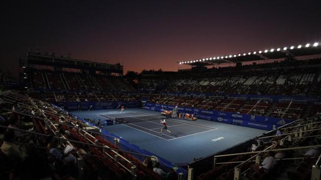 John Isner of the US, front, returns a ball in his semifinal match against Taylor Fritz of the US at the Mexican Tennis Open in Acapulco, Mexico. (Rebecca Blackwell / AP) John Isner of the US, front, returns a ball in his semifinal match against Taylor Fritz of the US at the Mexican Tennis Open in Acapulco, Mexico. (Rebecca Blackwell / AP)
