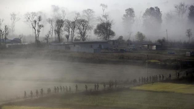 Nepalese armed police force personnel on their morning patrol walk through a mustard field in Khokana, Lalitpur, Nepal. (Niranjan Shrestha / AP) Nepalese armed police force personnel on their morning patrol walk through a mustard field in Khokana, Lalitpur, Nepal. (Niranjan Shrestha / AP)