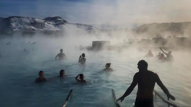 Bathers enjoy the warm volcanic hot springs of the Blue Lagoon in Grindavik, Iceland. (Hannah McKay / REUTERS) Bathers enjoy the warm volcanic hot springs of the Blue Lagoon in Grindavik, Iceland. (Hannah McKay / REUTERS)