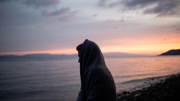 A migrant of Afghanistan is covered with a blanket on a beach near the village of Skala Sikamias, after crossing part of the Aegean Sea from Turkey to the island of Lesbos, Greece. (Alkis Konstantinidis / REUTERS) A migrant of Afghanistan is covered with a blanket on a beach near the village of Skala Sikamias, after crossing part of the Aegean Sea from Turkey to the island of Lesbos, Greece. (Alkis Konstantinidis / REUTERS)
