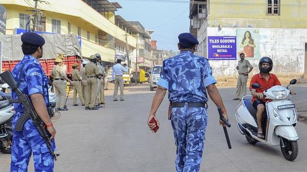Rapid Action Force (RAF) personnel and local police at a street following protests against the recently enacted Citizenship Amendment Act turned violent in several areas of Mangaluru on Dec. 22, 2019.(PTI)