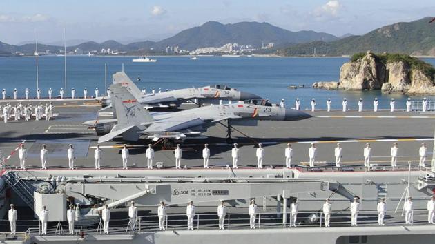 In this photo taken Dec. 17, 2019 and released Dec. 27, 2019 by Xinhua News Agency, sailors line the deck of the Shandong aircraft carrier during a commissioning ceremony held at a naval port in Sanya in southern China's Hainan Province. (AP) In this photo taken Dec. 17, 2019 and released Dec. 27, 2019 by Xinhua News Agency, sailors line the deck of the Shandong aircraft carrier during a commissioning ceremony held at a naval port in Sanya in southern China's Hainan Province. (AP)