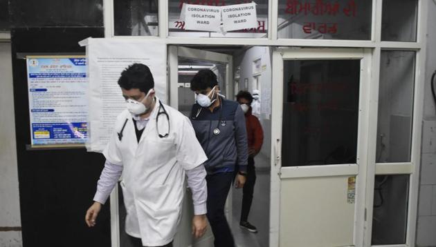 Doctors wearing masks inspection the isolation ward of Guru Nanak Dev Hospital after two Italy returned people have been diagnosed positive of Coronavirus in Amritsar.((Photo by Sameer Sehgal/Hindustan Times)) Doctors wearing masks inspection the isolation ward of Guru Nanak Dev Hospital after two Italy returned people have been diagnosed positive of Coronavirus in Amritsar.((Photo by Sameer Sehgal/Hindustan Times))