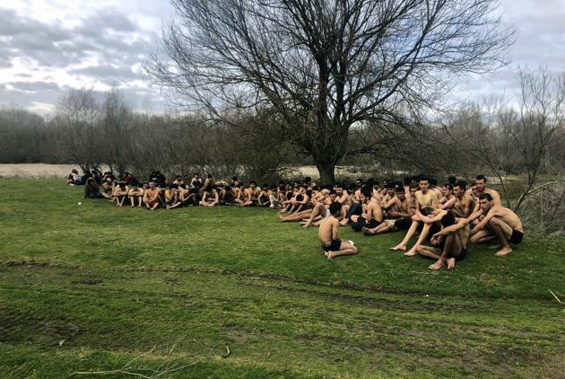 This photo provided by Turkey's IHA news agency taken Thursday, March 5, purports to show a group of some 100 migrants near the Turkey-Greece border, in Uzunkopru, Edirne, Turkey. The agency says the migrants were sent back to Turkey from Greece by Greek security forces after allegedly being stripped of their clothes on Thursday. (AP) This photo provided by Turkey's IHA news agency taken Thursday, March 5, purports to show a group of some 100 migrants near the Turkey-Greece border, in Uzunkopru, Edirne, Turkey. The agency says the migrants were sent back to Turkey from Greece by Greek security forces after allegedly being stripped of their clothes on Thursday. (AP)