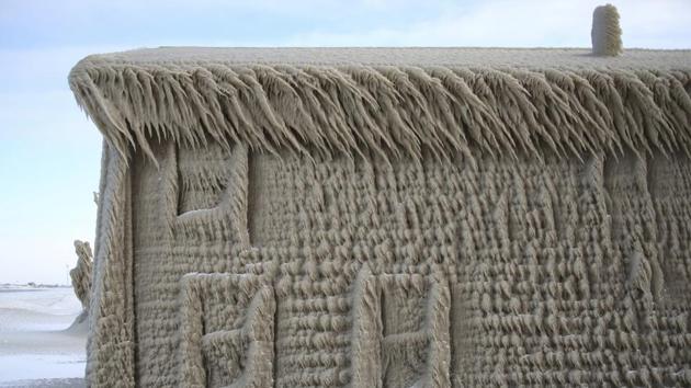 A house along Hoover Beach is covered by ice formed by high winds in Hamburg, New York, USA. (Jeffrey T. Barnes / AP) A house along Hoover Beach is covered by ice formed by high winds in Hamburg, New York, USA. (Jeffrey T. Barnes / AP)