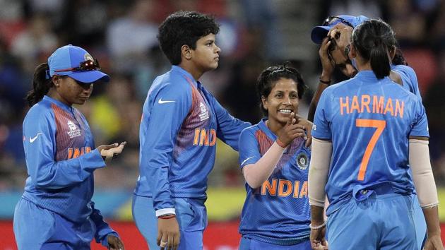 File image: India's Poonam Yadav, center, is congratulated by teammates.(AP)