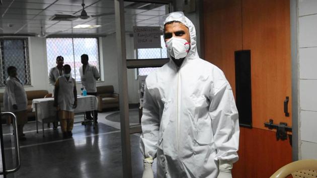 Medical staff with protective clothing seen inside a ward specialised in receiving any person who may have been infected with coronavirus, at Lok Nayak Jai Prakash Narayan (LNJP) Hospital, in New Delhi, India, on Thursday, March 5, 2020.(HT file photo) Medical staff with protective clothing seen inside a ward specialised in receiving any person who may have been infected with coronavirus, at Lok Nayak Jai Prakash Narayan (LNJP) Hospital, in New Delhi, India, on Thursday, March 5, 2020.(HT file photo)
