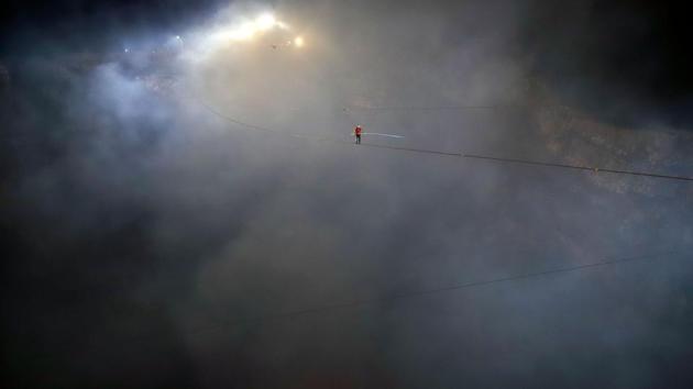 A picture released on March 5 by American Broadcasting Companies (ABC) shows US acrobat Nik Wallenda as he crosses the 1,800 foot high wire walk over the Masaya Volcano in Nicaragua. Wallenda became the first person to complete the full crossing. (Oscar Duarte / American Broadcasting Companies / AFP) A picture released on March 5 by American Broadcasting Companies (ABC) shows US acrobat Nik Wallenda as he crosses the 1,800 foot high wire walk over the Masaya Volcano in Nicaragua. Wallenda became the first person to complete the full crossing. (Oscar Duarte / American Broadcasting Companies / AFP)