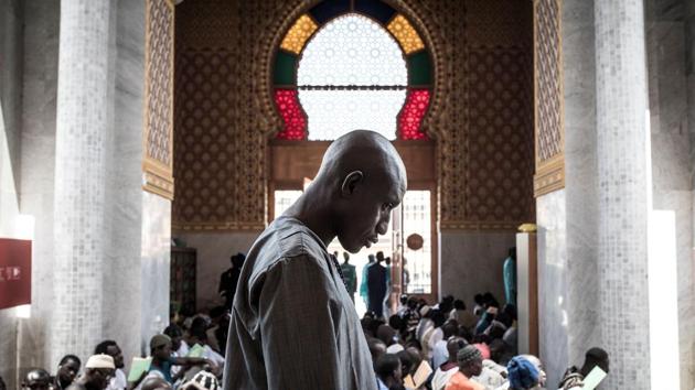 A Muslim worshipper attends a mass prayer against COVID-19, the new coronavirus, in Dakar, Senegal, after two cases were confirmed in the country in the previous days. (John Wessels / AFP) A Muslim worshipper attends a mass prayer against COVID-19, the new coronavirus, in Dakar, Senegal, after two cases were confirmed in the country in the previous days. (John Wessels / AFP)
