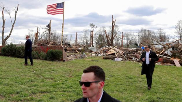 US Secret Service agents stand by as US President Donald Trump (not pictured) observes tornado damage in Cookeville, Tennessee, USA. (Tom Brenner / REUTERS) US Secret Service agents stand by as US President Donald Trump (not pictured) observes tornado damage in Cookeville, Tennessee, USA. (Tom Brenner / REUTERS)