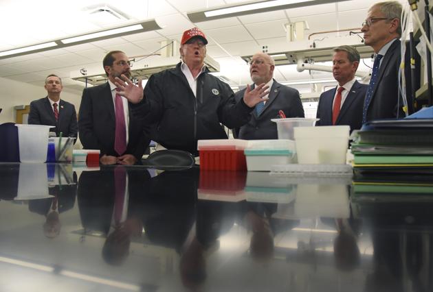 President Donald Trump speaks to members of the press at the headquarters of the Centers for Disease Control and Prevention in Atlanta. (AP) President Donald Trump speaks to members of the press at the headquarters of the Centers for Disease Control and Prevention in Atlanta. (AP)