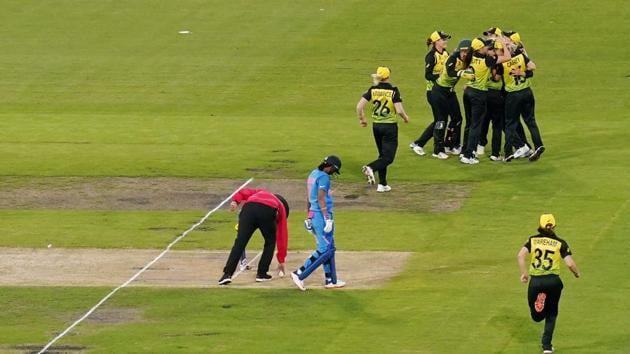 Australian team members celebrate a wicket during the Women's T20 World Cup final cricket match between Australia and India at the MCG in Melbourne.(REUTERS)