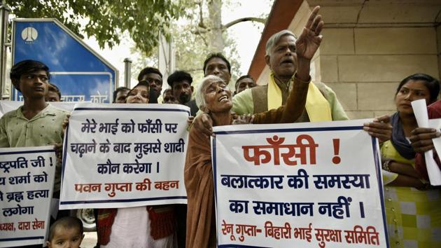 People hold placards as the mother of Mukesh, one of the convicts in the 2012 Delhi gang rape case, wails outside Patiala House Court, in New Delhi. (Burhaan Kinu / HT Photo) People hold placards as the mother of Mukesh, one of the convicts in the 2012 Delhi gang rape case, wails outside Patiala House Court, in New Delhi. (Burhaan Kinu / HT Photo)