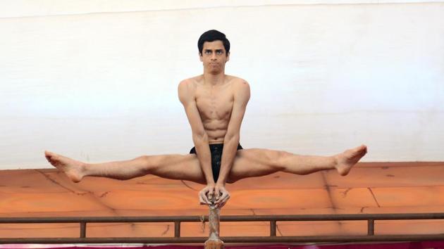 Shubhankar Khavale performs mallakhamb, in Pune, Maharashtra. (Ravindra Joshi / HT Photo) Shubhankar Khavale performs mallakhamb, in Pune, Maharashtra. (Ravindra Joshi / HT Photo)