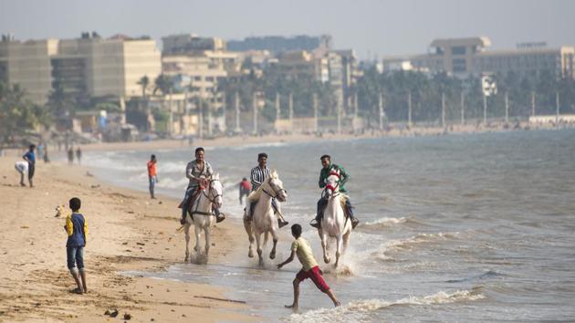 Three men ride horses on a sea-side at Versova, in Mumbai, Maharashtra. (Satyabrata Tripathy / HT Photo) Three men ride horses on a sea-side at Versova, in Mumbai, Maharashtra. (Satyabrata Tripathy / HT Photo)